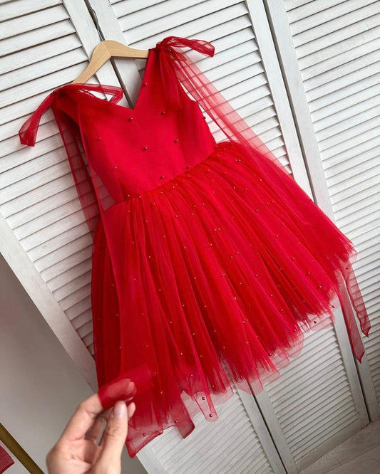 Red dress with bows on the shoulders and beads