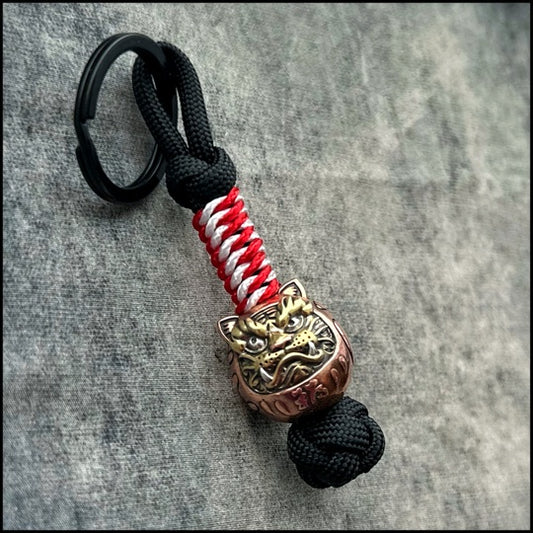 Daruma paracord bead