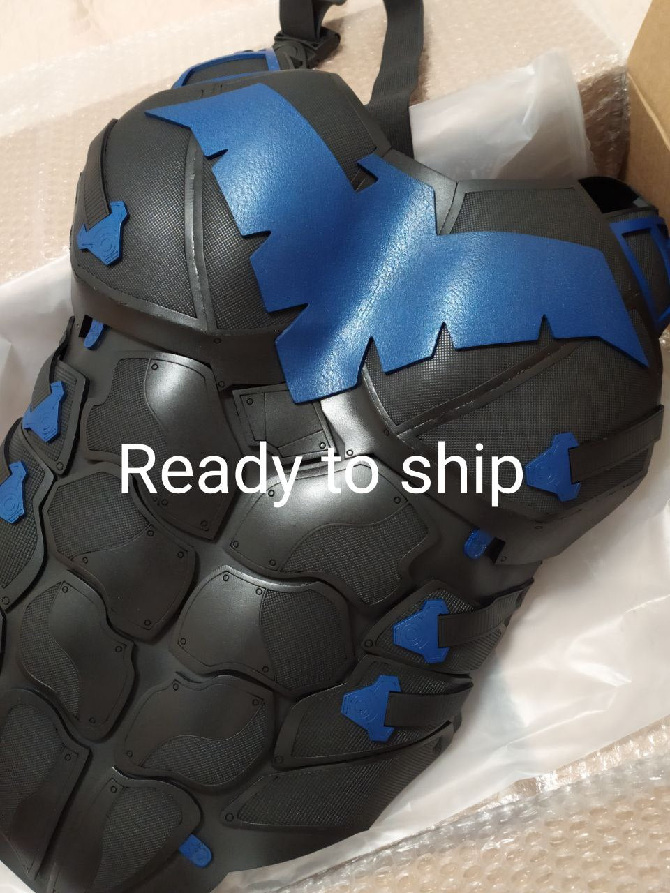 Black and blue tire with 'Ready to ship' text on a white background