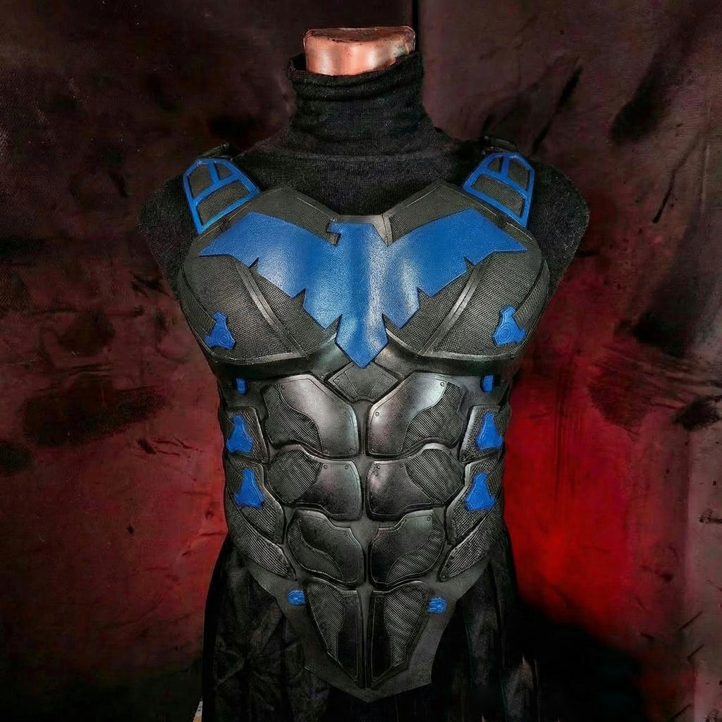 Black and blue superhero costume on a mannequin against a dark background