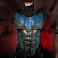 Black and blue superhero costume on a mannequin against a dark background