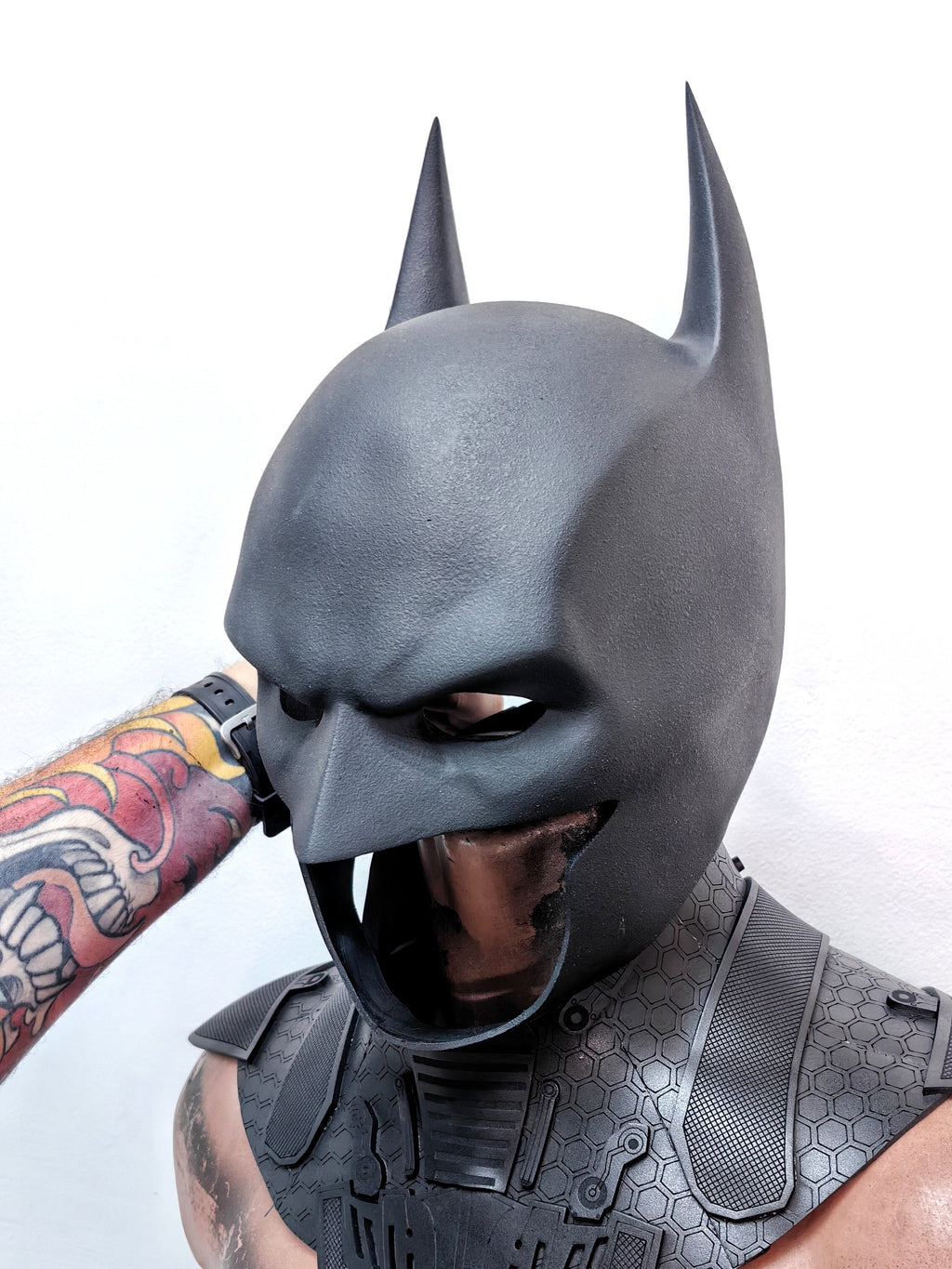 Side profile of the Batman mask showcasing the iconic long ears and aggressive silhouette.