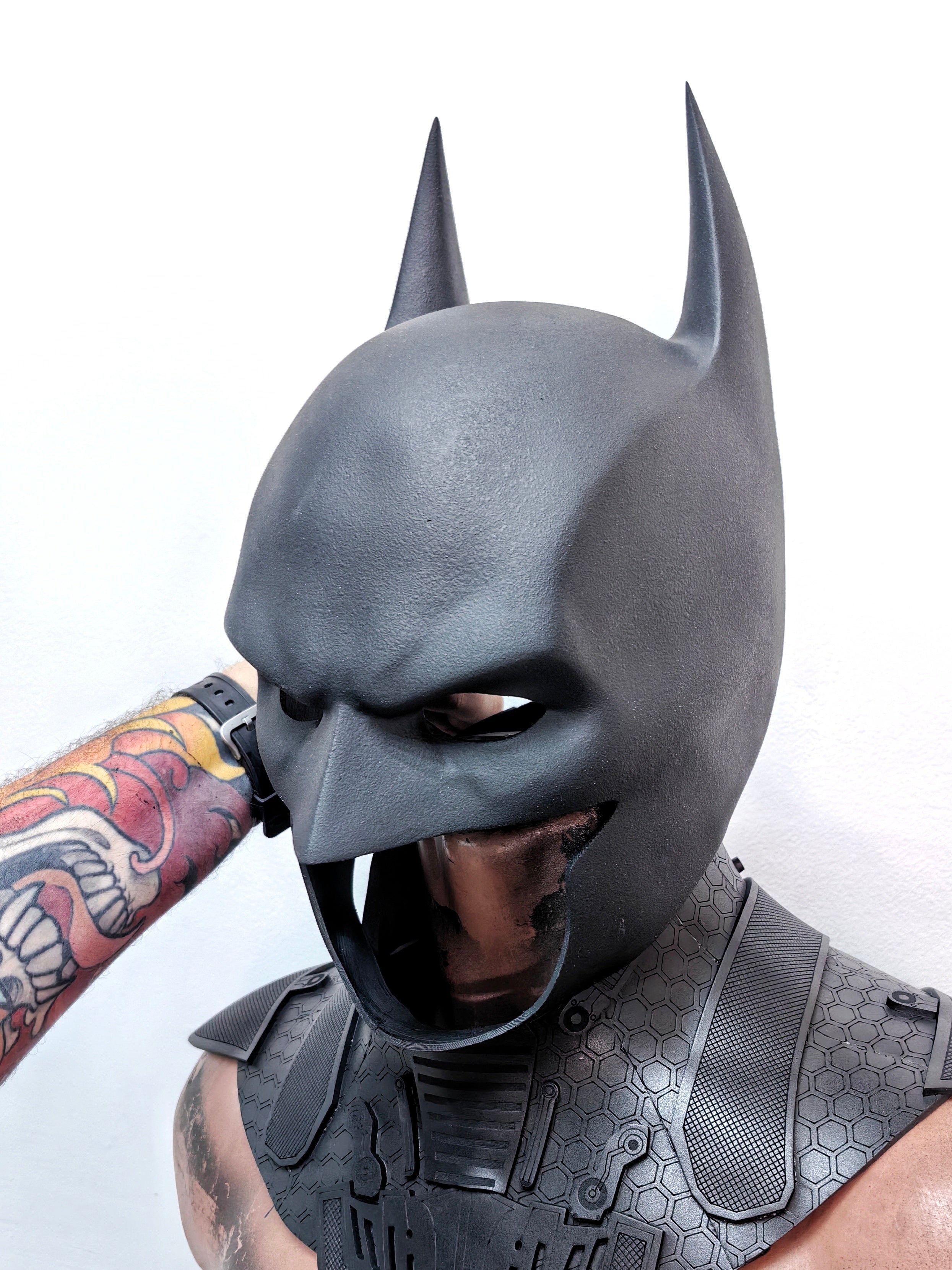 Side profile of the Batman mask showcasing the iconic long ears and aggressive silhouette.