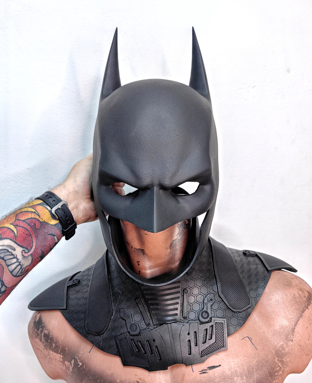 Three-quarter angle of a professional Batman cosplay helmet inspired by DC Comics aesthetics.