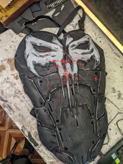 Side profile of the Punisher-inspired chest plate showing the ergonomic curved design.