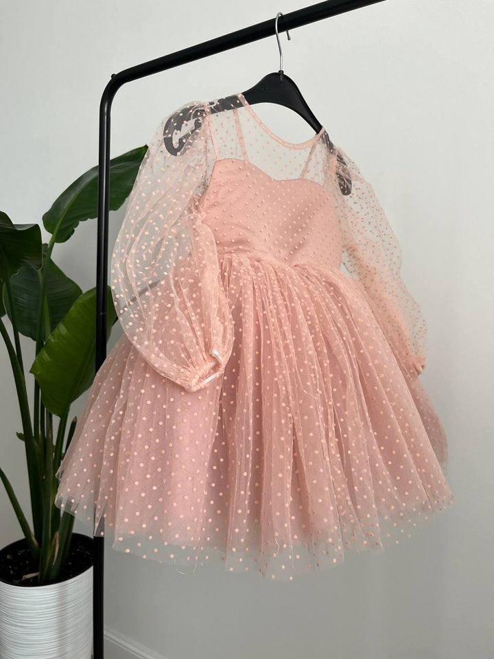 Dress in soft pink with small polka dots