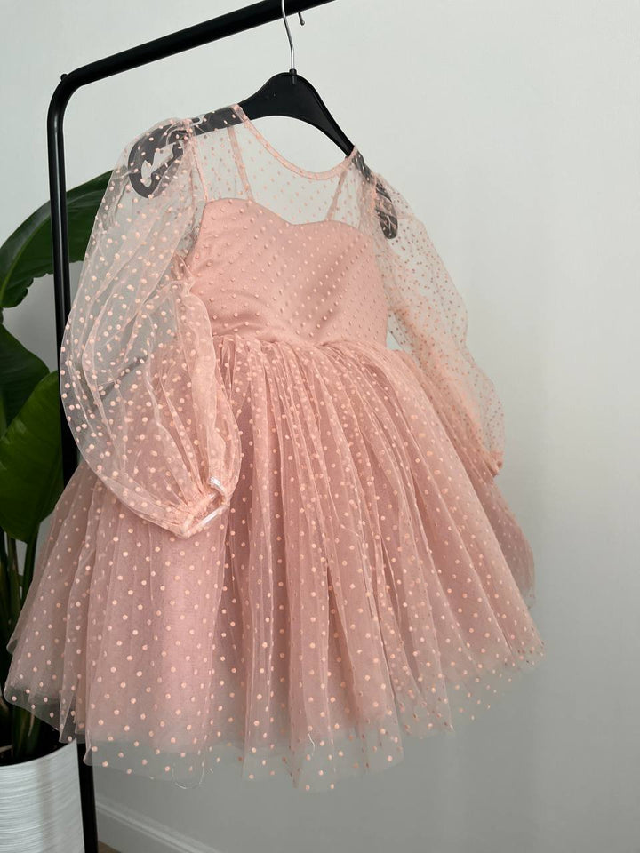 Dress in soft pink with small polka dots