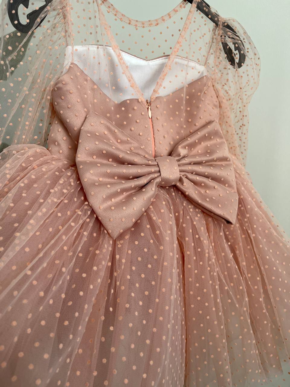 Dress in soft pink with small polka dots