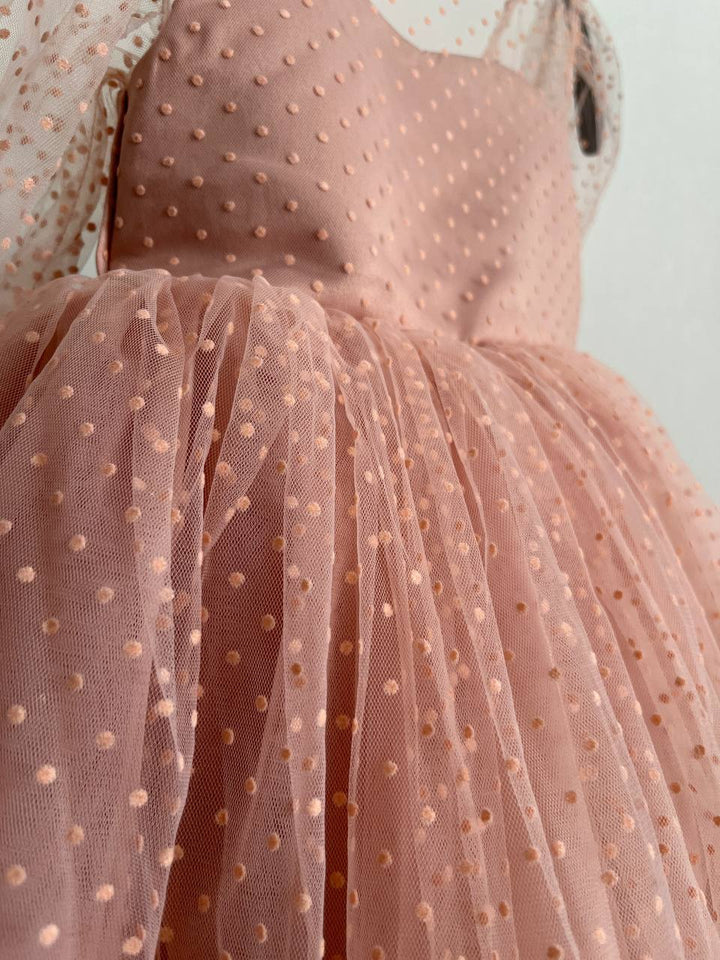 Dress in soft pink with small polka dots