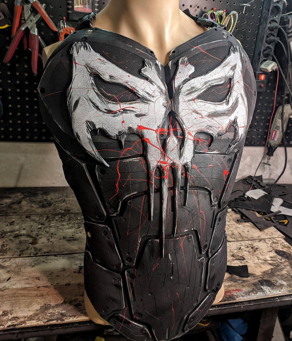 Close-up of the battle-worn texture and distressed skull logo on the Punisher breastplate.