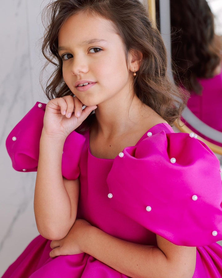 Tulip dress in raspberry color with puffy sleeves embroidered with beads