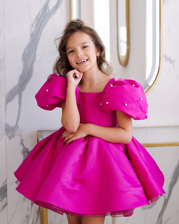Tulip dress in raspberry color with puffy sleeves embroidered with beads