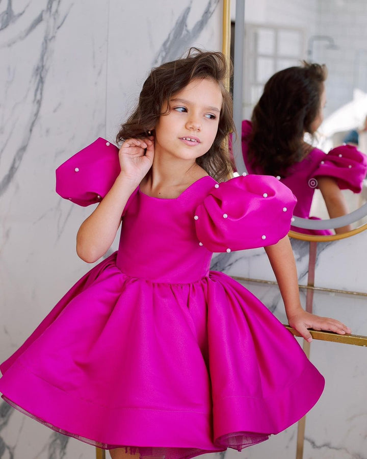 Tulip dress in raspberry color with puffy sleeves embroidered with beads