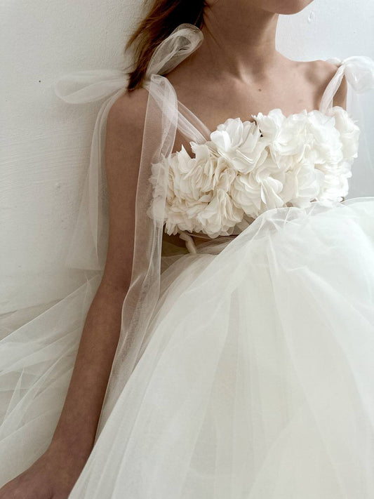 Ivory romantic dress with imitation corset line, floral bodice and delicate delicate tulle ties