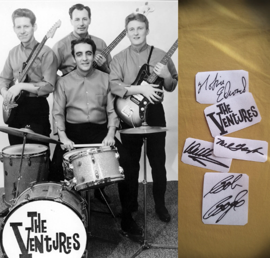 Autographs stickers of The Ventures band members displayed with a photo of the band taken during their career.